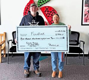 Disc Golf ROC donation to Foodlink 2026